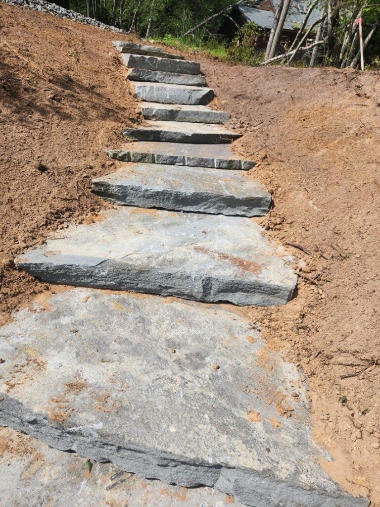 landscaping and hard scaping steps into a hillside.